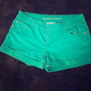 Turquoise shorts.